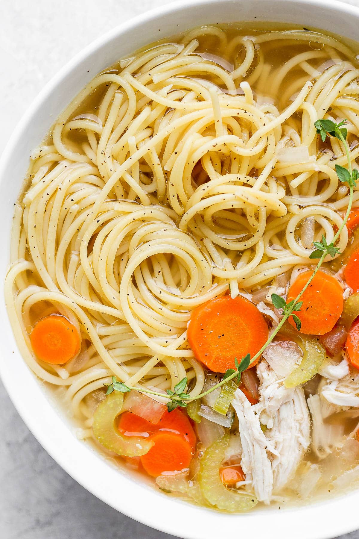 A bowl of slow cooker chicken noodle soup.