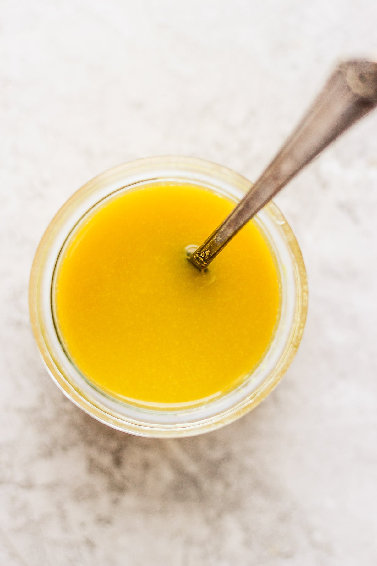 Jar of mustard vinaigrette dressing. 