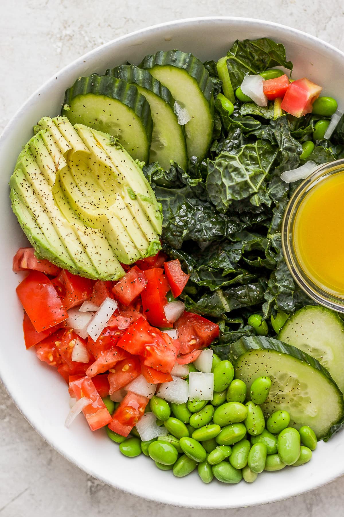 Bowl of tomato and kale salad. 