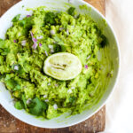 Fresh Homemade Guacamole with Tomatoes, Onion and Garlic - a light and refreshing guacamole recipe that goes with almost anything! #whole30 #guacamole #summerfood