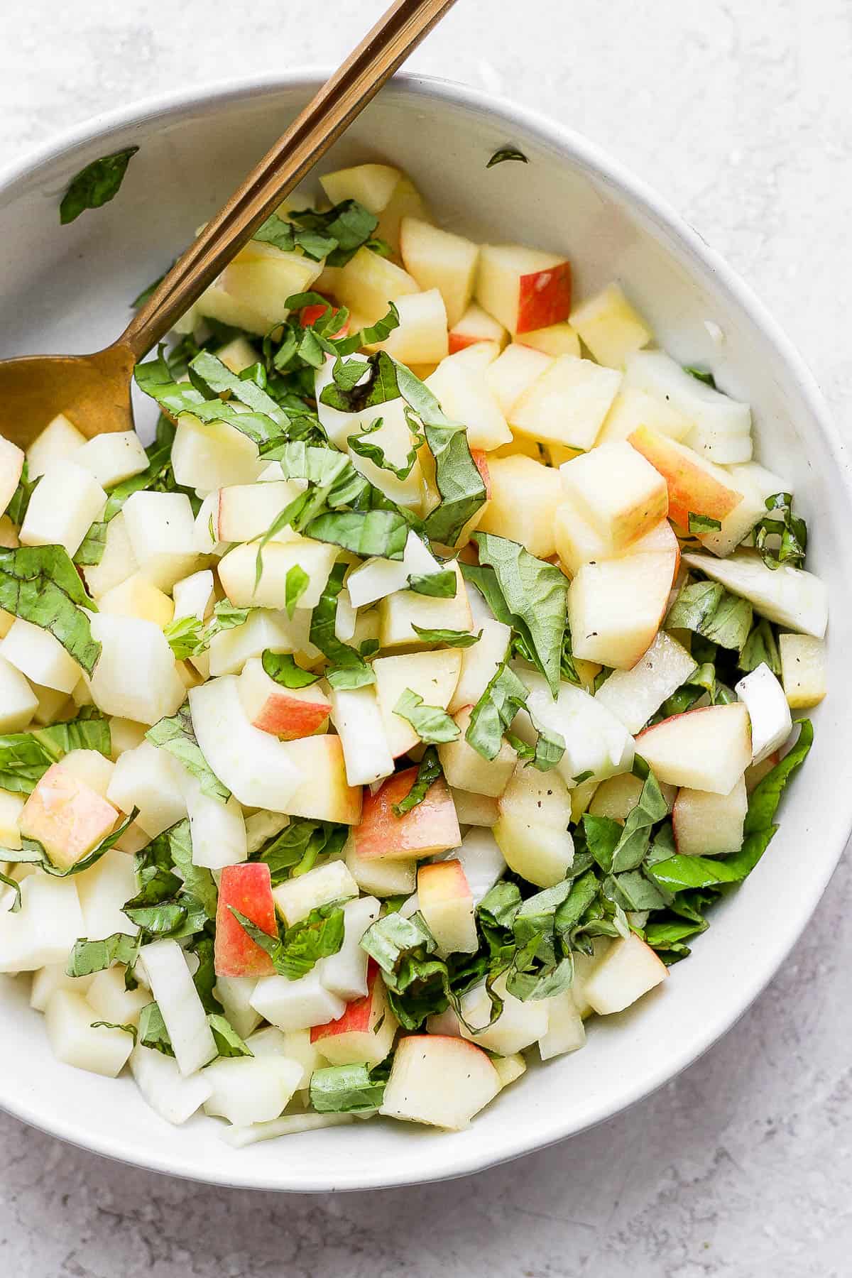 Fennel salad in a bowl, all ingredients mixed together. 