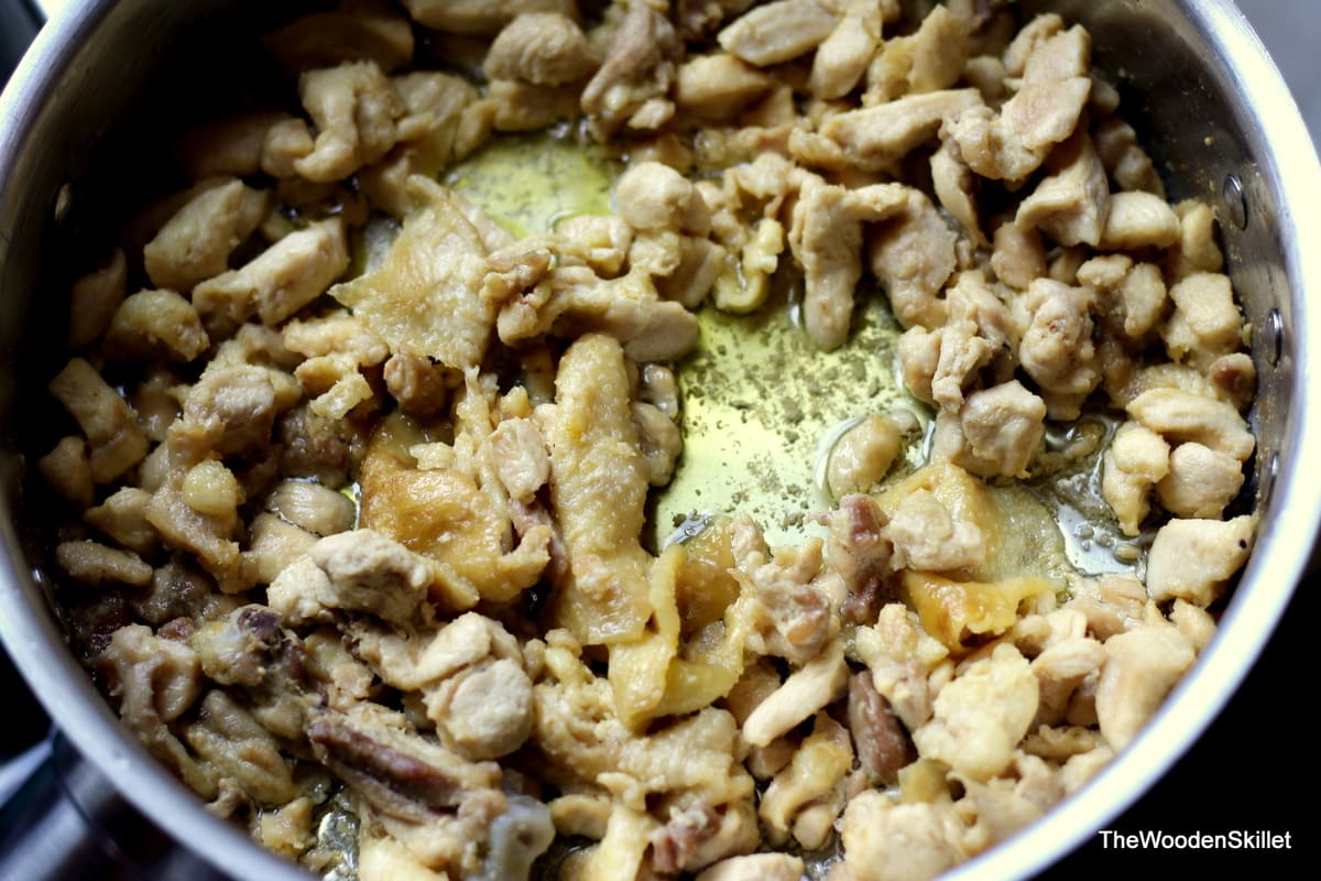 Showing how the cooked chicken fat is rendering in the pan. 