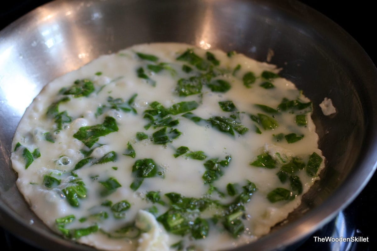 Egg white cooking in a pan. 