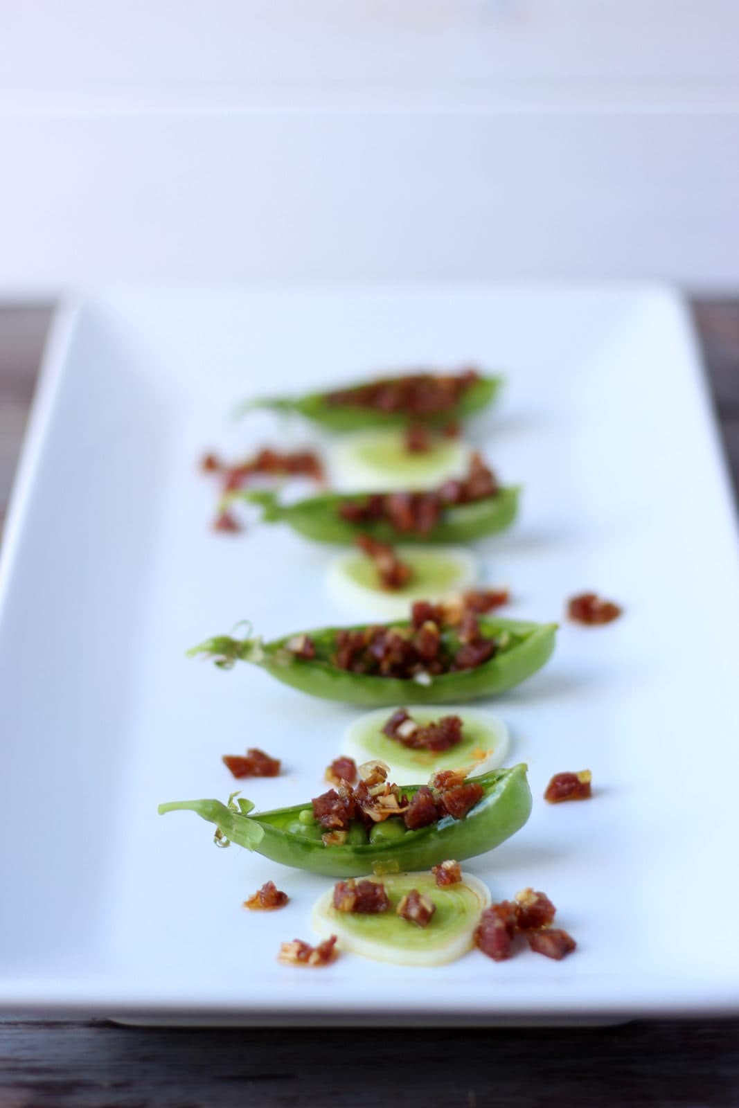 Spanish Chorizo and Leek Stuffed Pea Pods - thewoodenskillet.com #appetizer