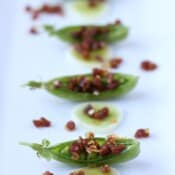 Chorizo and Leek Stuffed Pea Pods - thewoodenskillet.com #appetizer #spanishchorizo