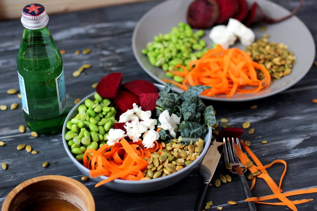 Raw Kale Summer Salad with Beets, Carrots, Edamame, Pumpkin Seeds and Goat Cheese with Honey Vinaigrette - thewoodenskillet.com 