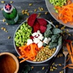 Raw Summer Salad with Beets, Carrot, Edamame, Pumpkin Seeds, Kale and Goat Cheese with Honey Viniagrette - thewoodenskillet.com