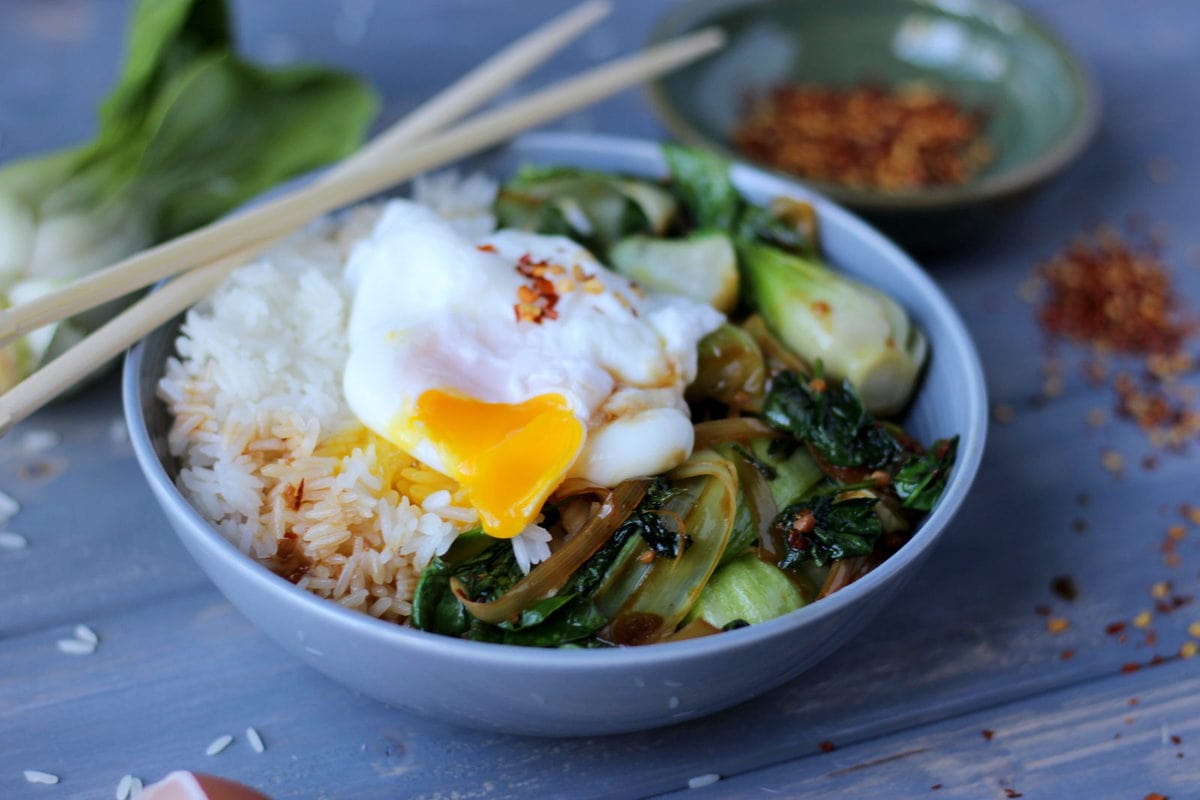 Vegetarian Rice Bowl with Braised Baby Bok Choy, Leeks and Spinach with Poached Egg and Red Pepper Flakes 