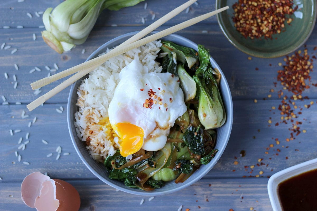 Vegetarian Rice Bowl with Braised Baby Bok Choy, Leeks and Spinach with Poached Egg and Red Pepper Flakes 