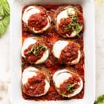 A baking dish full of baked eggplant parmesan.