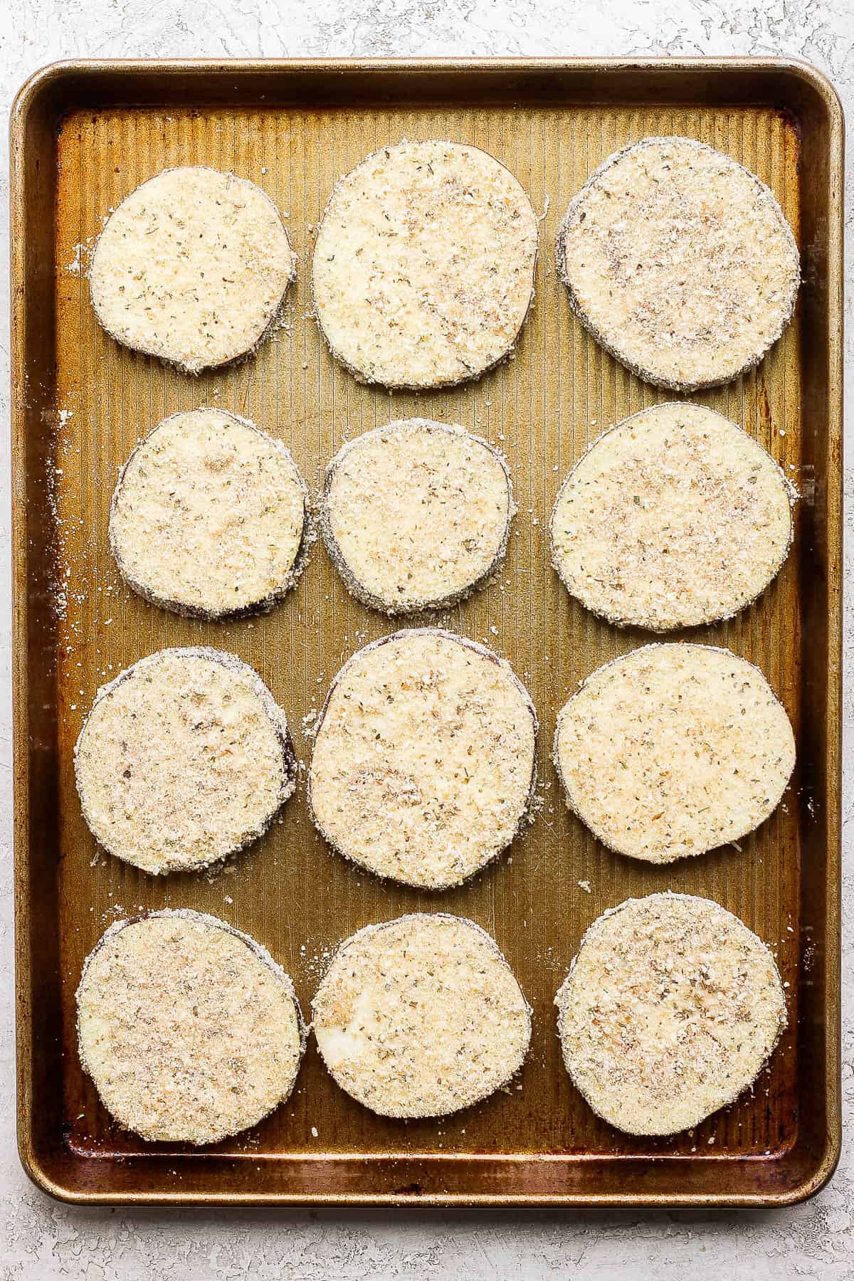 Prepared eggplant on a baking sheet.