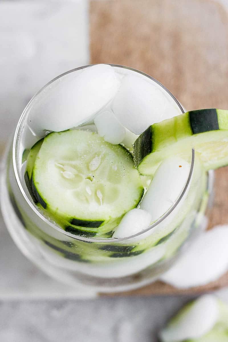 Top shot of a cucumber vodka and water. 