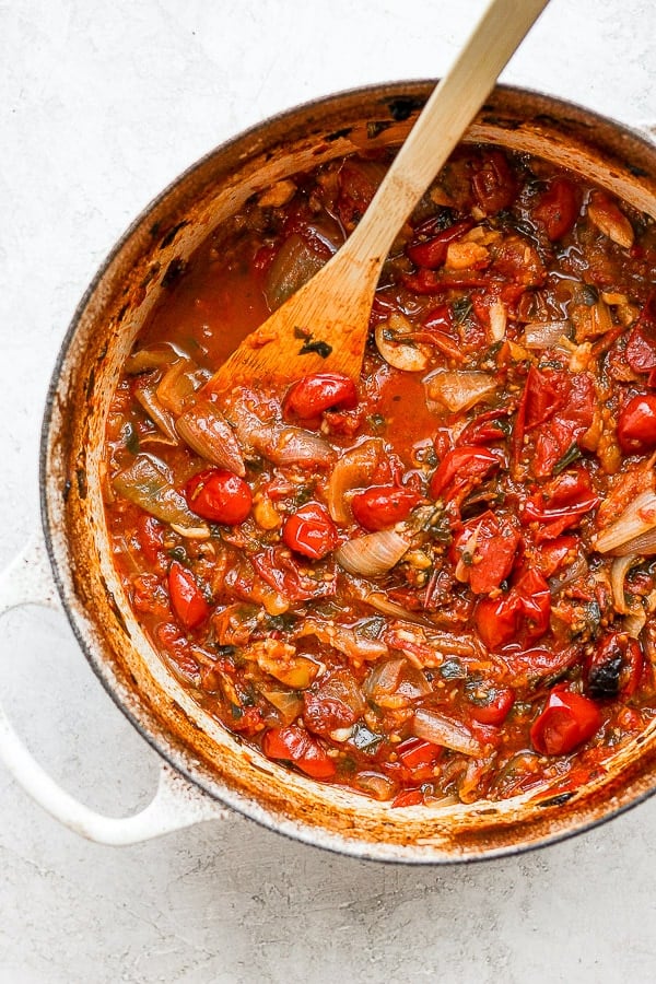 Dutch oven filled with roasted tomatoes. 