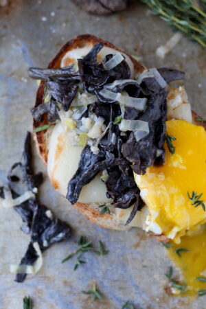 Creamy Leeks and Black Trumpet Mushrooms on Toast with Cheese and Poached Egg - a great recipe for the fall - thewoodenskillet.com