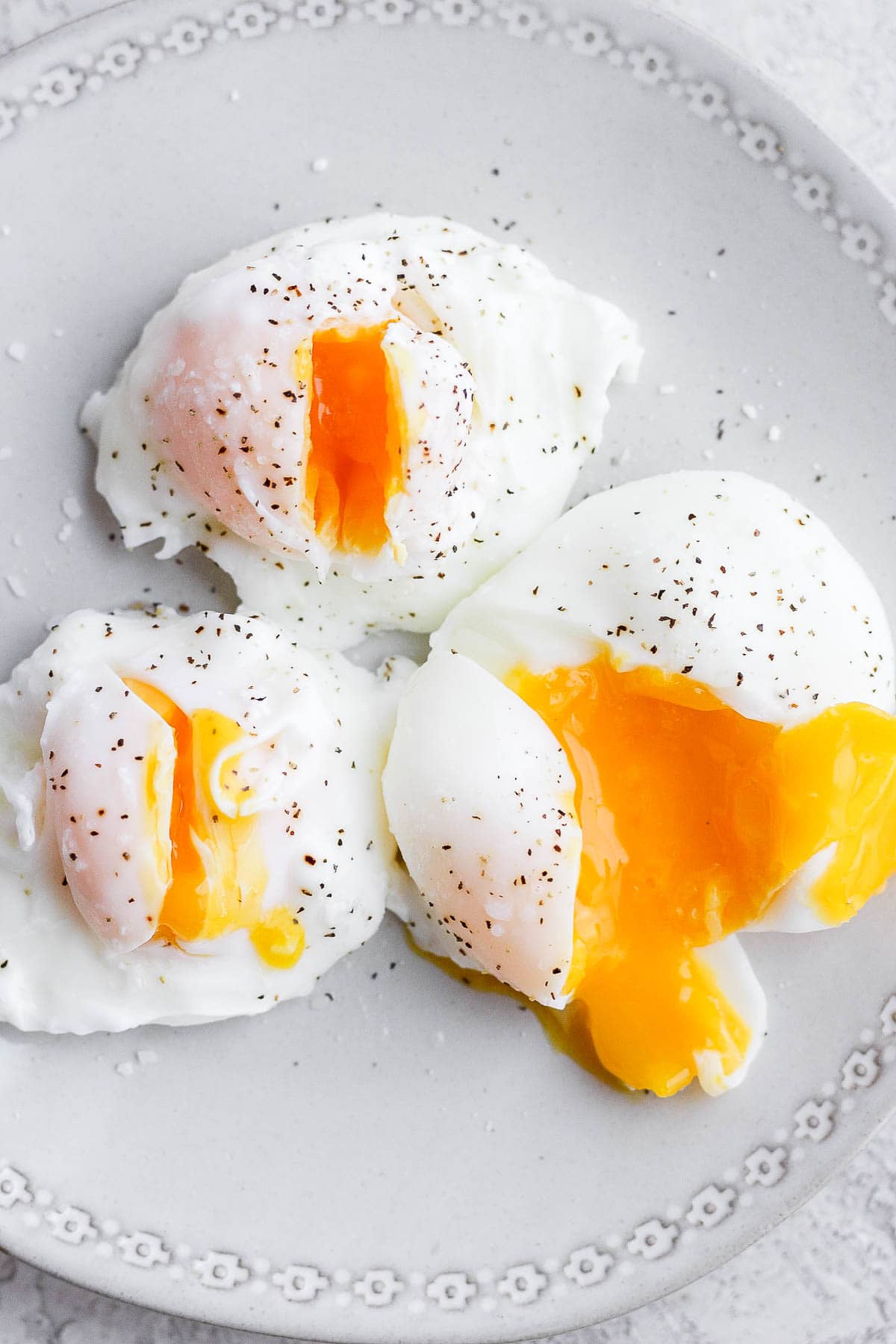 Three poached eggs on a plate. 