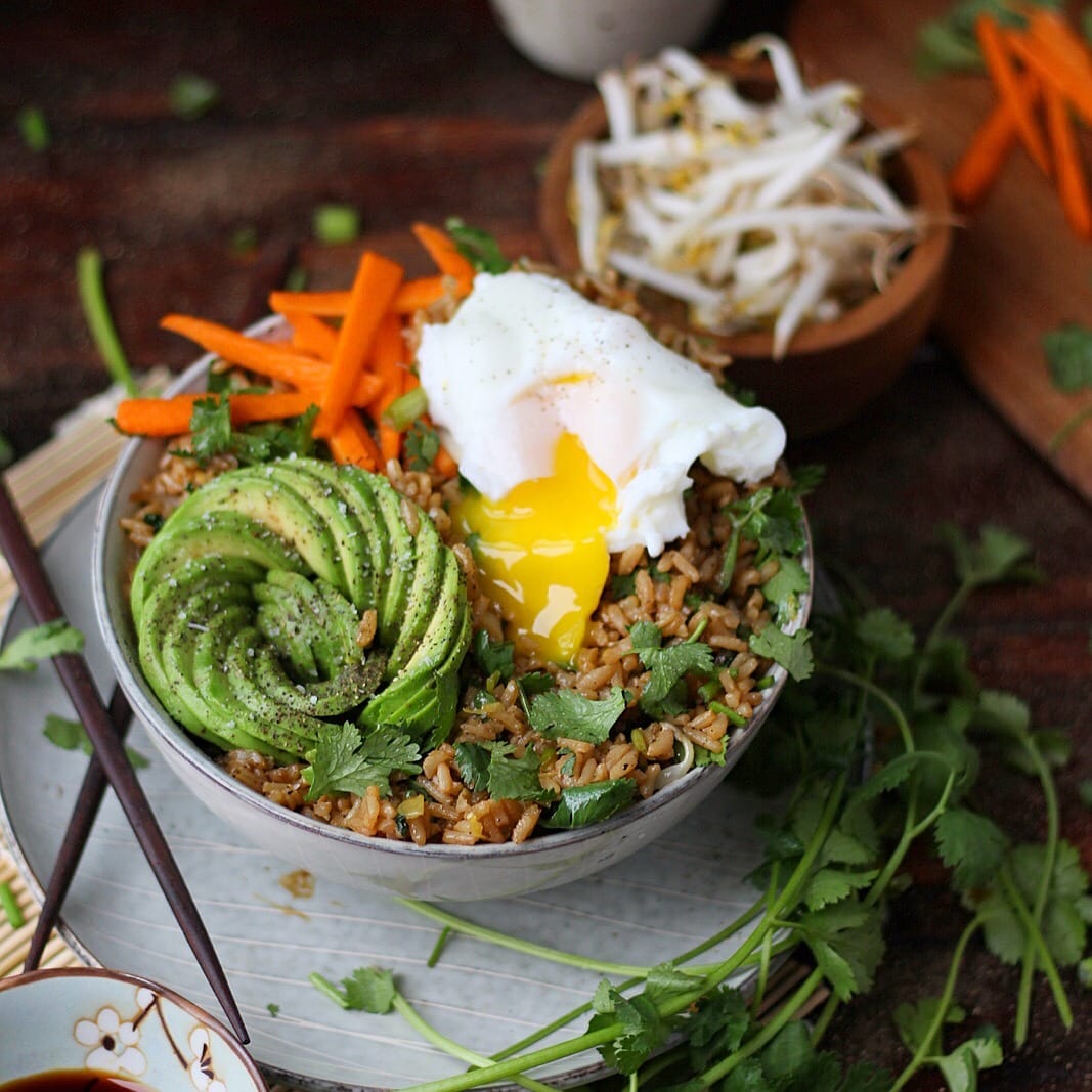 A bowl of vegetarian fried rice with a poached egg.