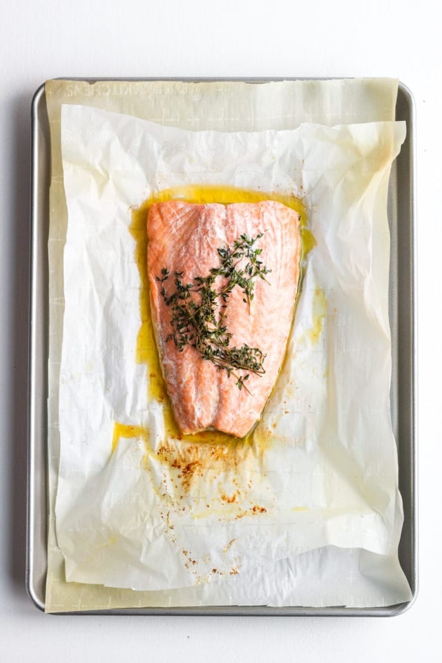 Salmon en Papillote just out of the oven on a baking sheet.