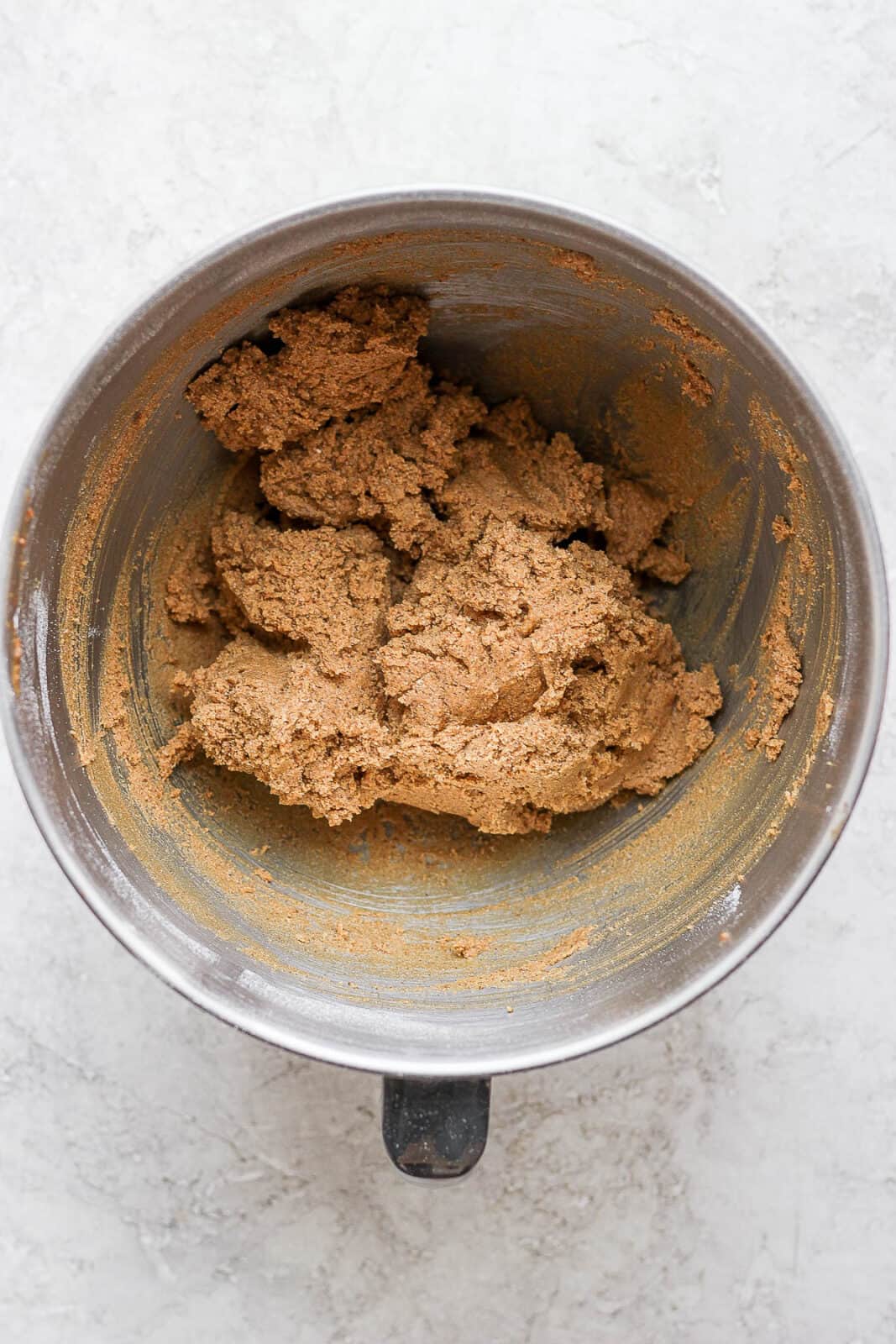 Dry and wet ingredients mixed together in a stand mixer bowl. 