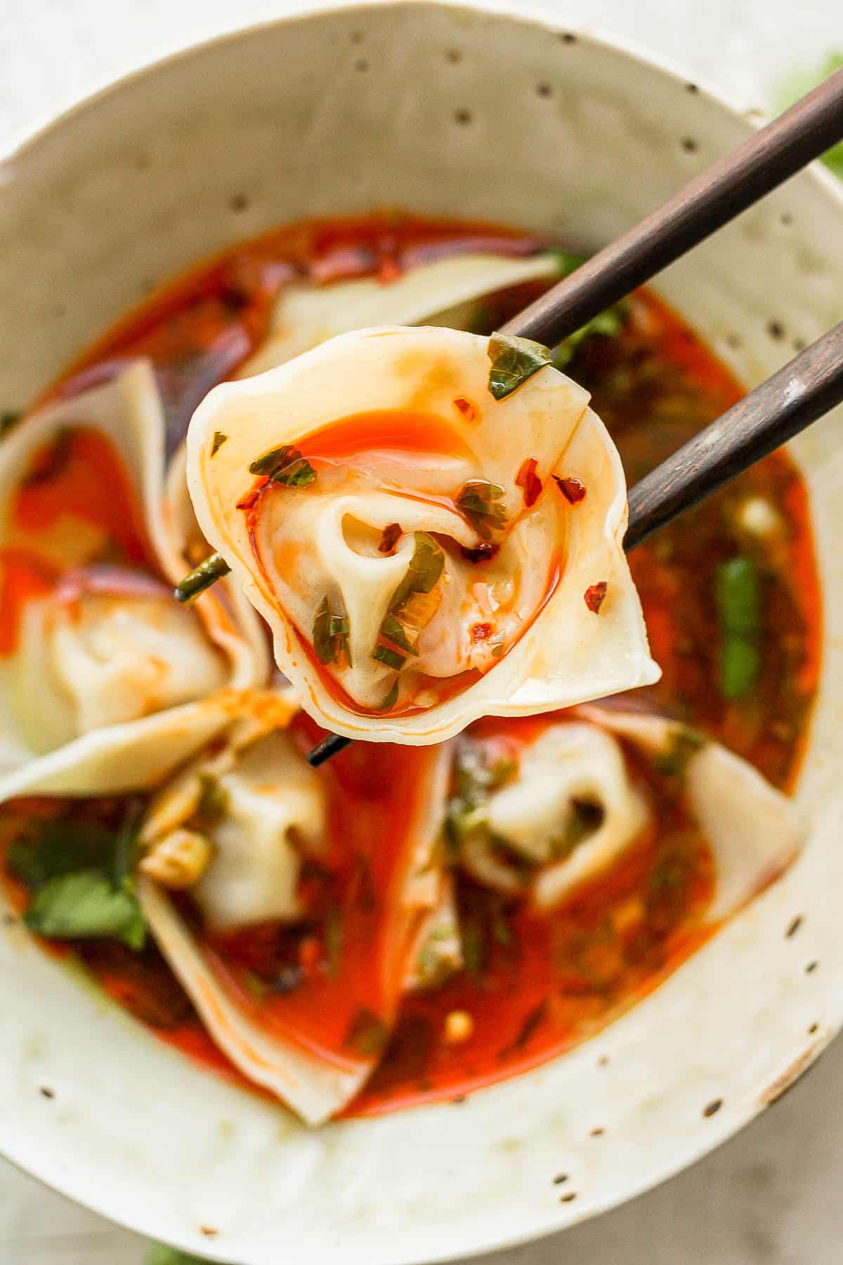 A close-up of a spicy pork wonton.
