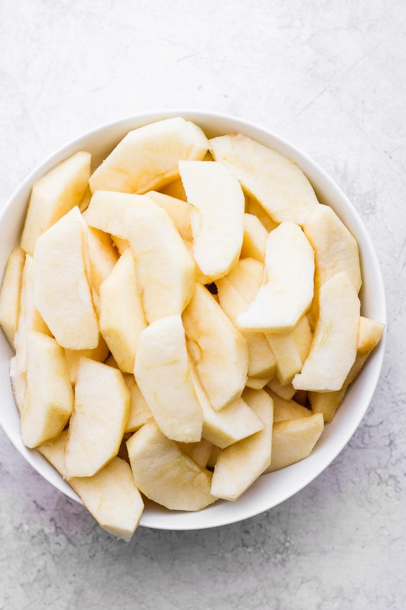 Bowl of peeled and sliced apples. 