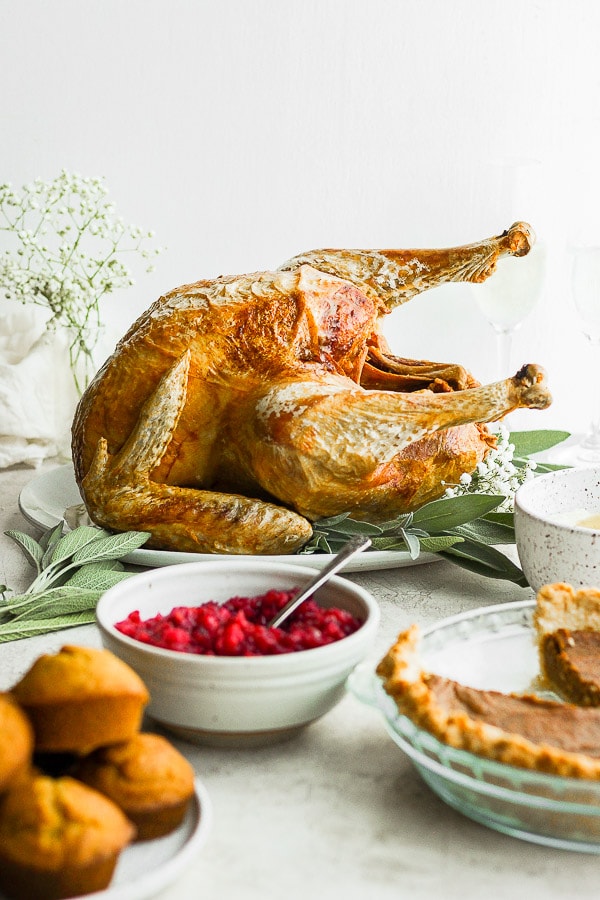A deep fried turkey on a Thanksgiving table. 