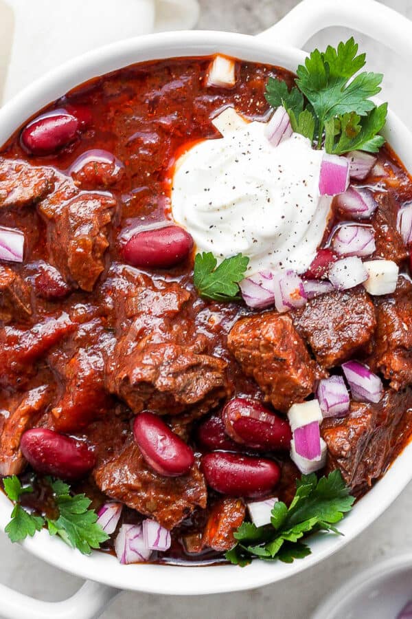 Bowl of short rib chili with horseradish sour cream.