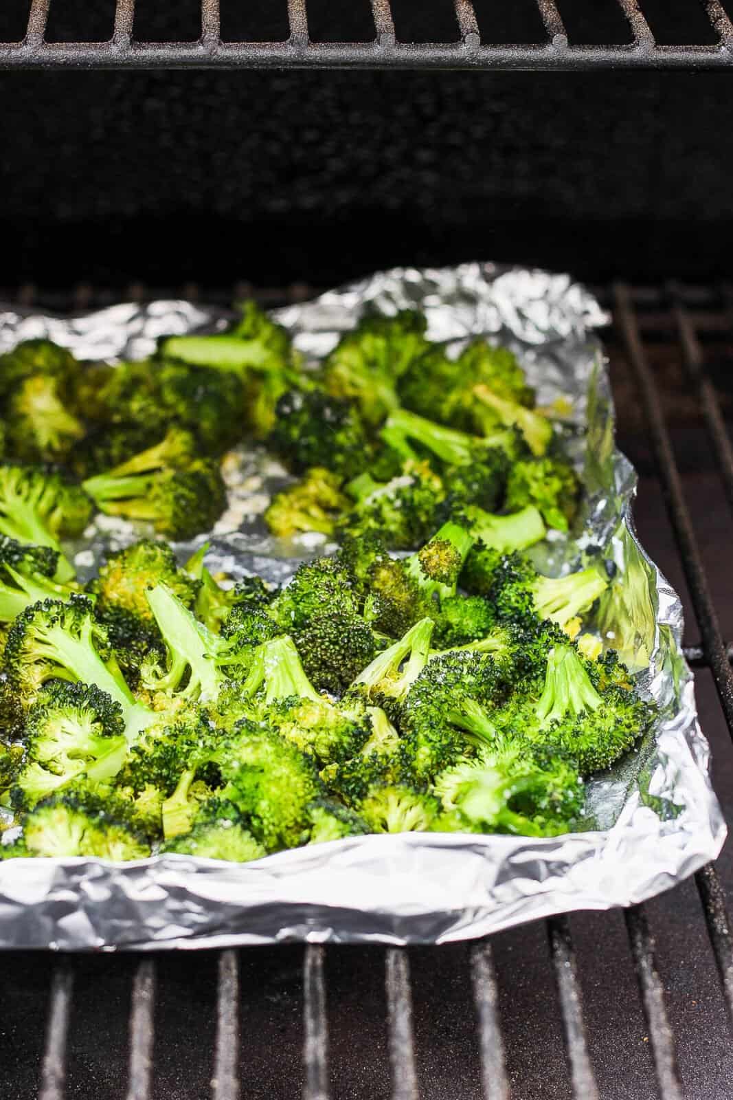 Broccoli smoking on the smoker.