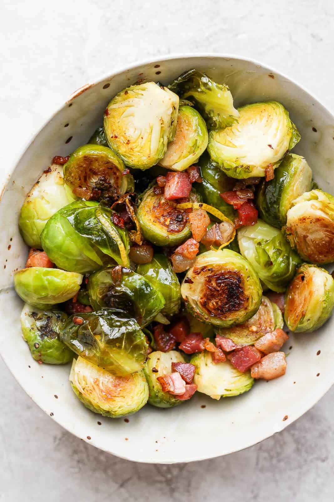 Bowl of roasted brussel sprouts and pancetta.