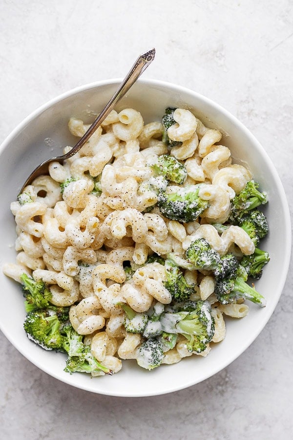 Goat Cheese Mac and Cheese + Roasted Broccoli in a bowl with a spoon. 