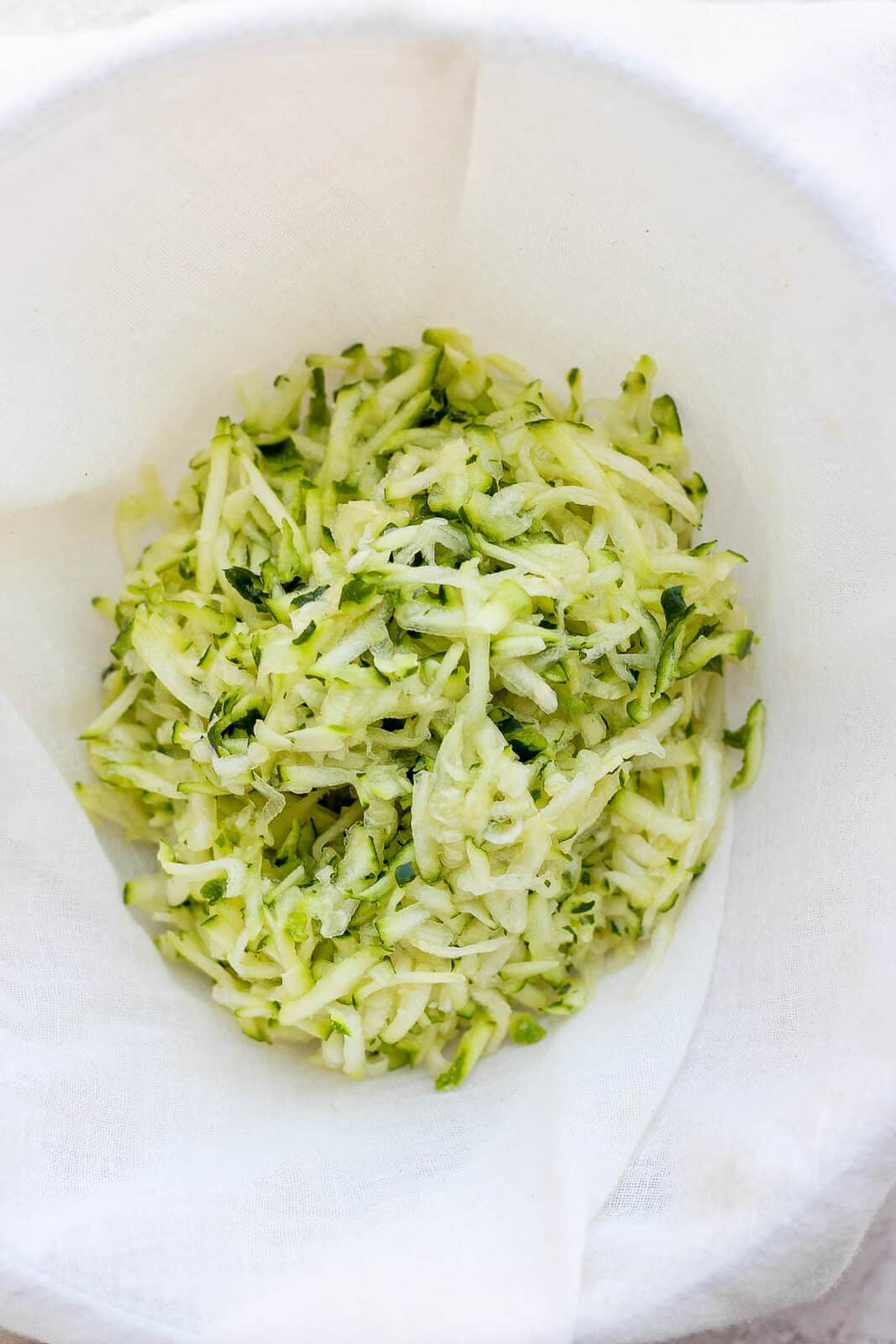 Shredded zucchini in a bowl. 