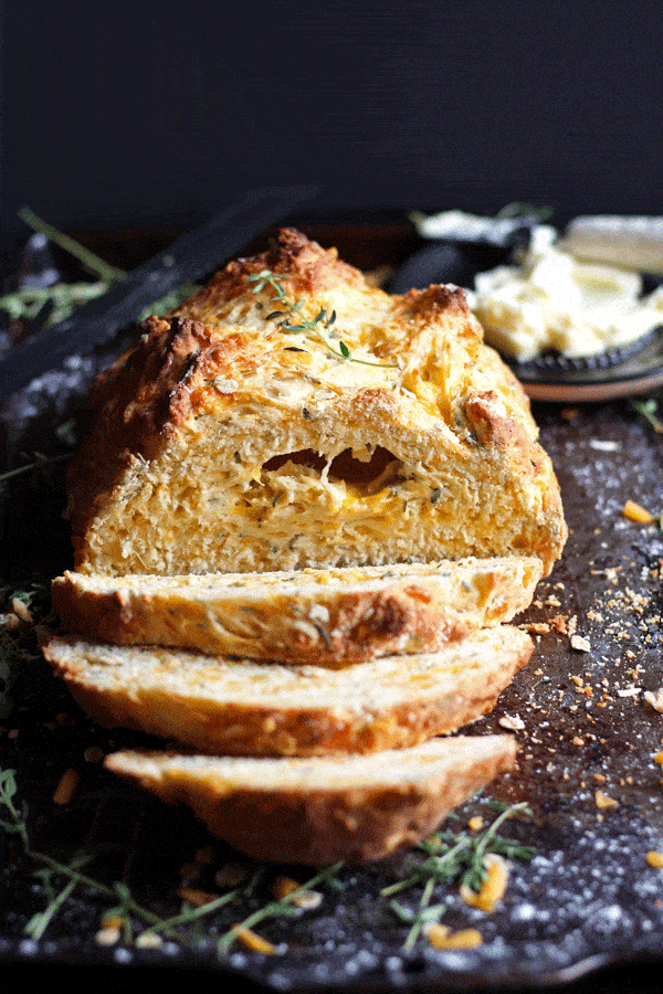 The Irish soda bread sliced on a cutting board.