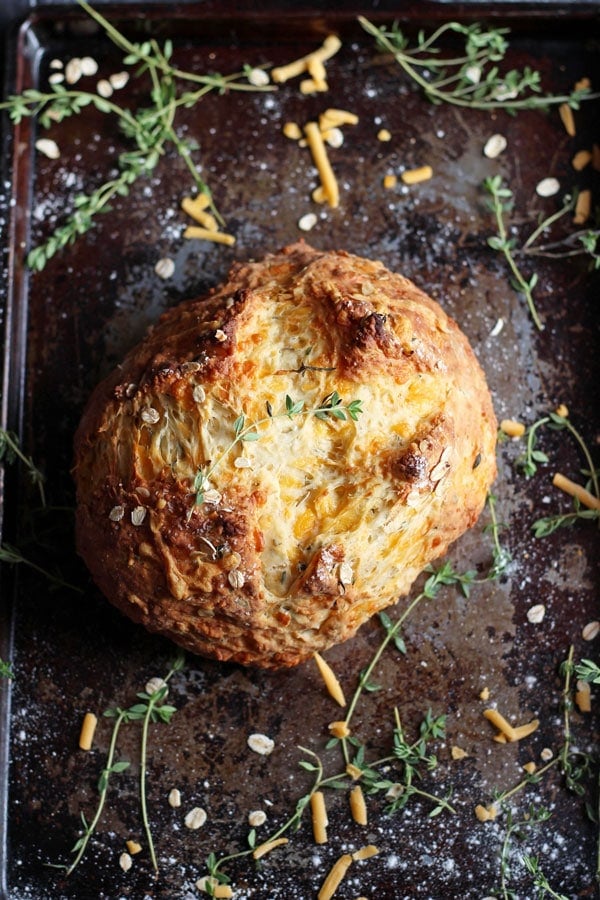 A fully baked soda bread on a baking sheet.