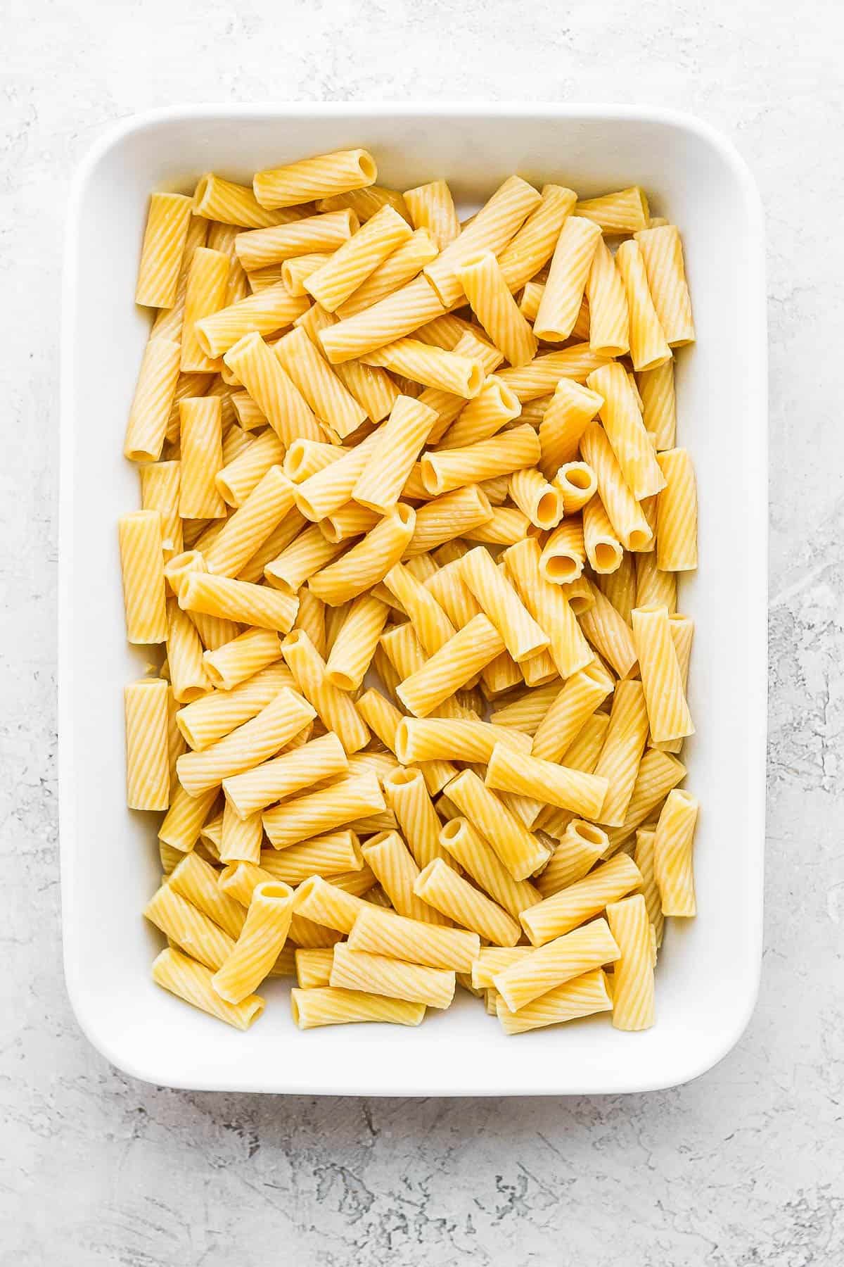 Rigatoni, cooked al dente, in a 9x13 pan.