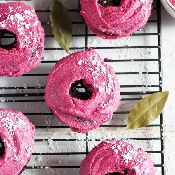 Vegan Chocolate Donut + Pink Beet Coconut Butter Cream Frosting - perfect recipe for Easter or Valentine's Day! thewoodenskillet.com