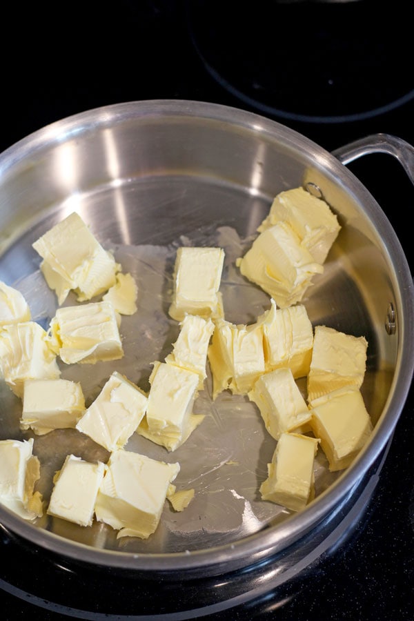 Chunks of butter in a deep skillet.
