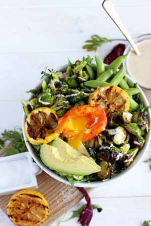 Healthy Spring Green Salad + Turmeric Egg. The perfect vegetarian salad that works for lunch or dinner!! thewoodenskillet.com