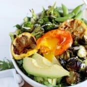 Healthy Spring Green Salad + Turmeric Egg. The perfect vegetarian salad that works for lunch or dinner!! thewoodenskillet.com