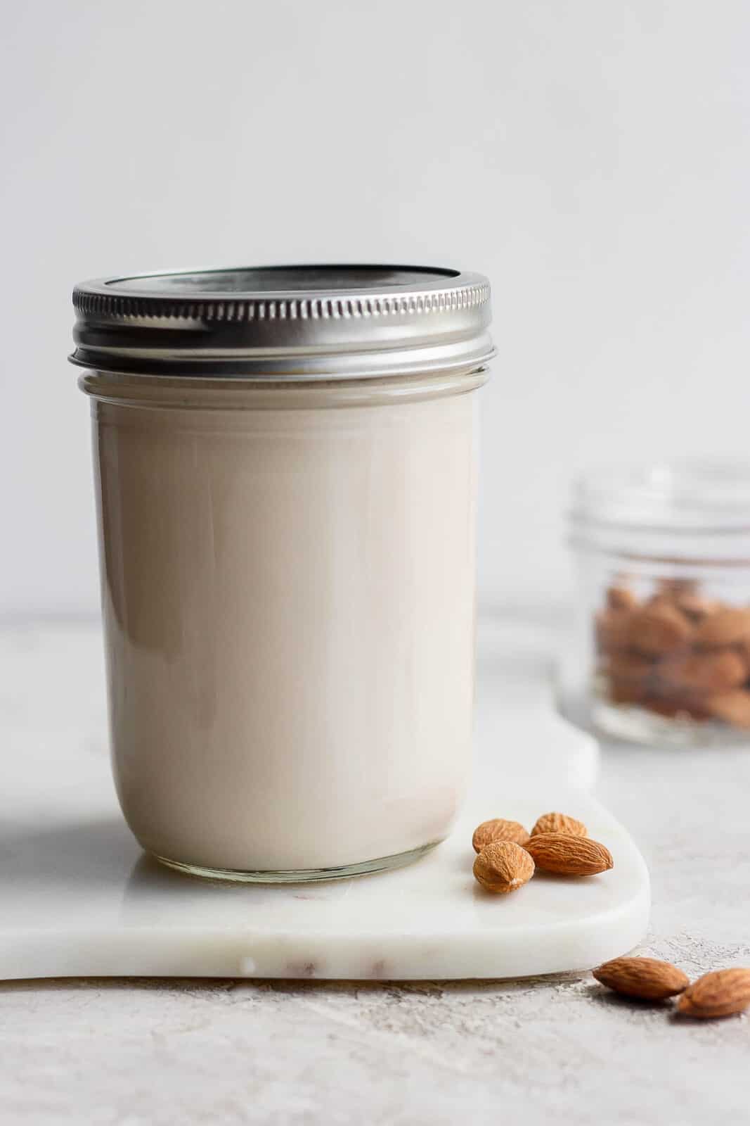 A mason jar of homemade almond milk. 