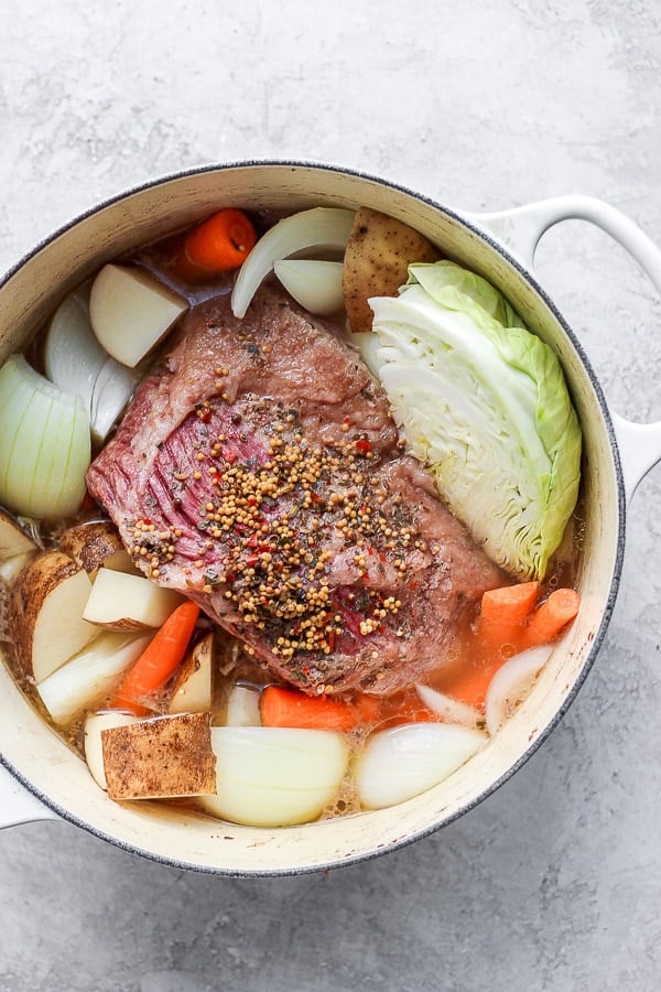 Dutch oven filled with corned beef and cabbage. 