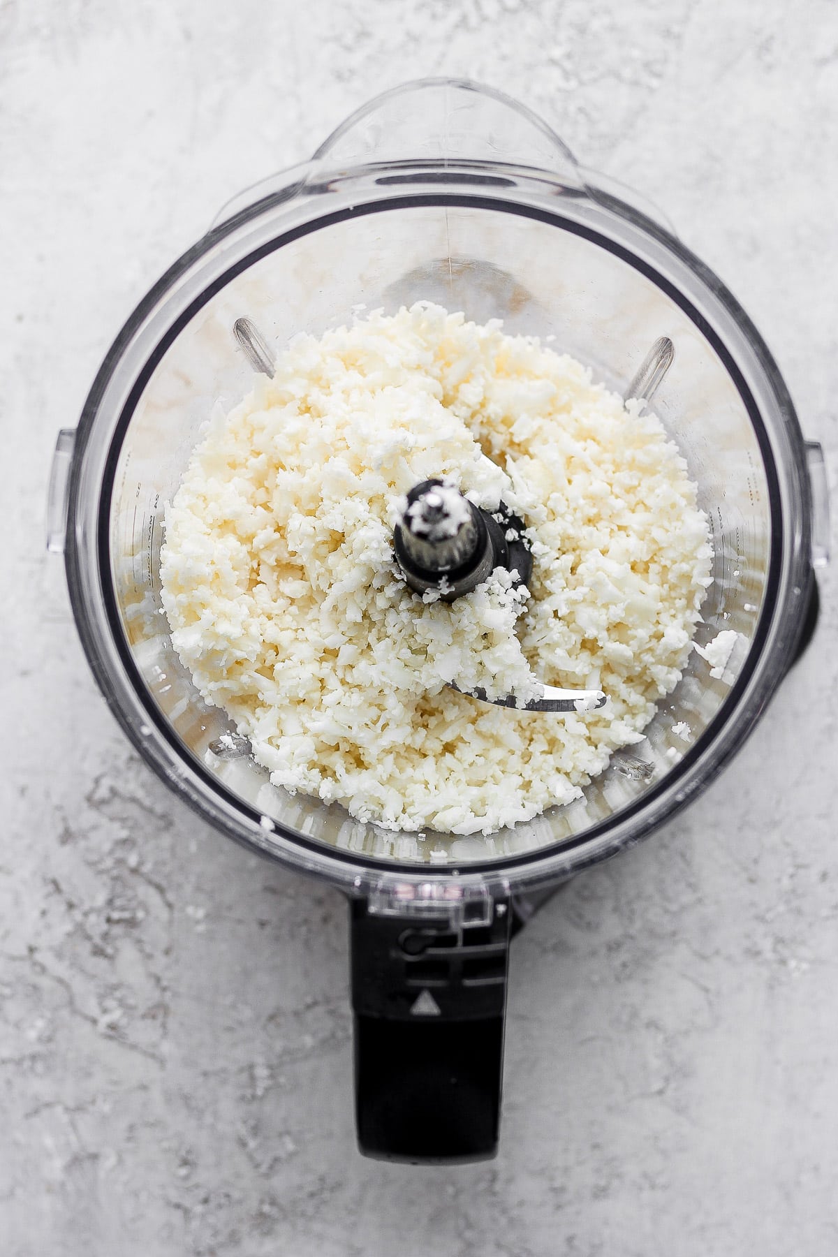 Riced cauliflower in a food processor. 