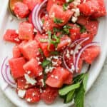 A platter of watermelon feta salad with mint.