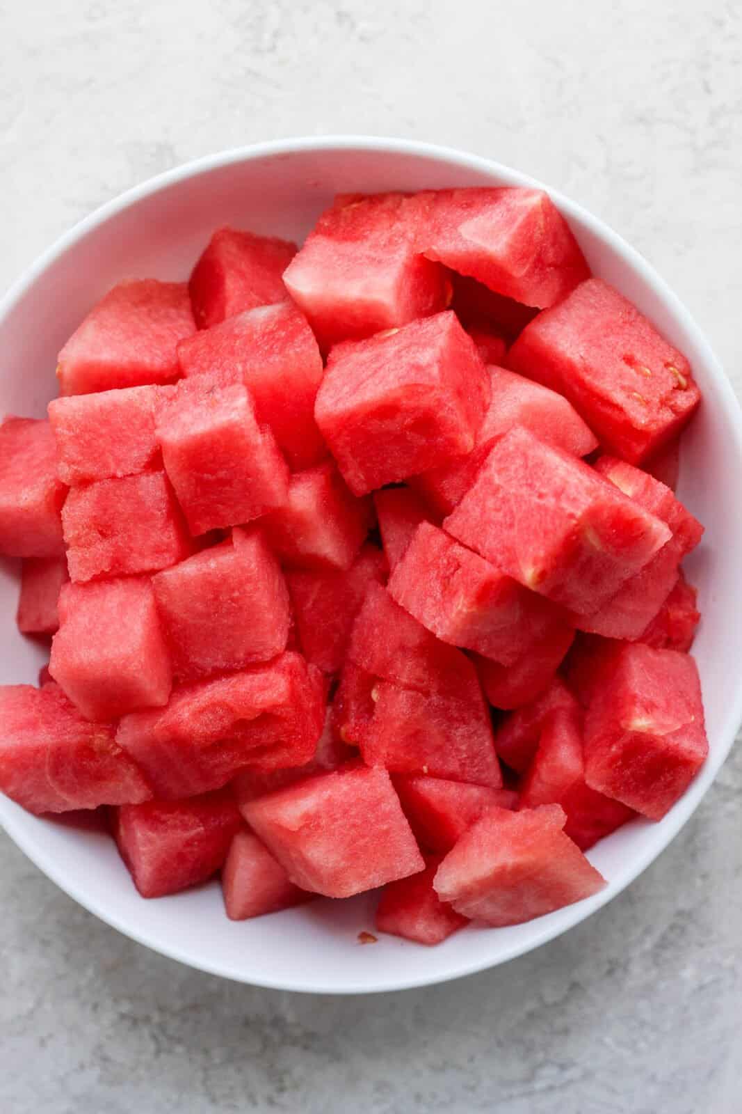 A bowl of cut up watermelon.