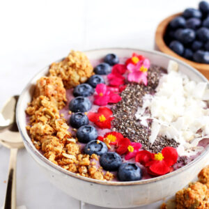 Coconut Blueberry Smoothie Bowl + Chia Seeds. A light, vegan breakfast that will keep you energized all morning long! thewoodenskillet.com