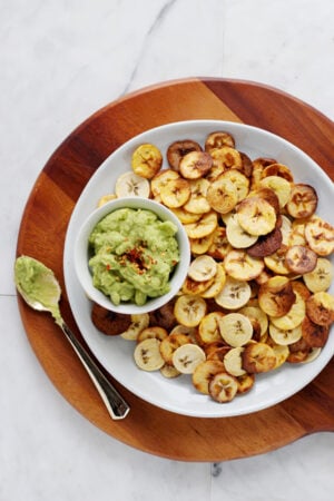 How to Make Homemade Plantain Chips - served with guacamole, these are the perfect healthy, holiday appetizer! #whole30 thewoodenskillet.com