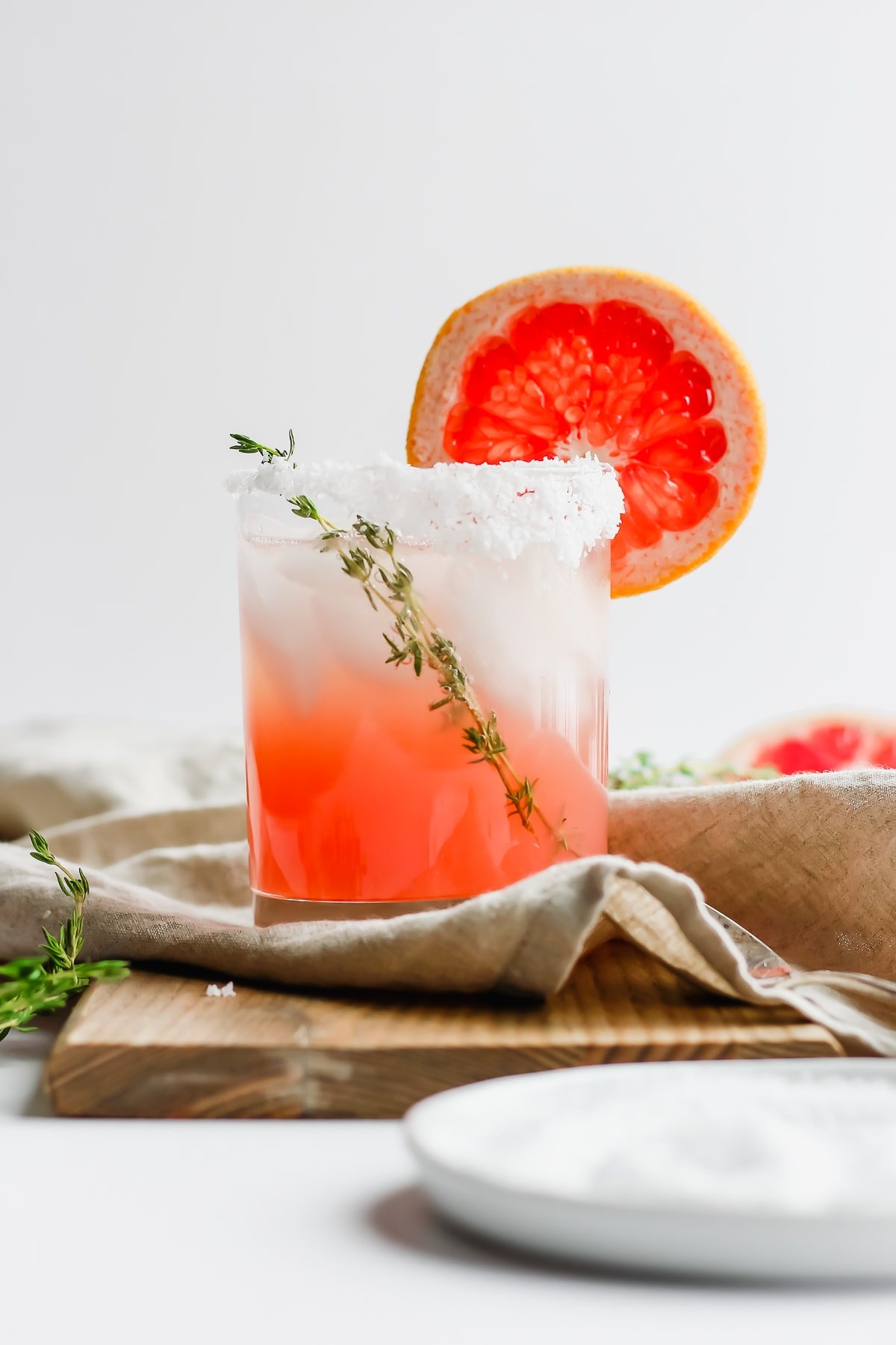 Citrus Paloma Mocktail with Thyme in a glass. 