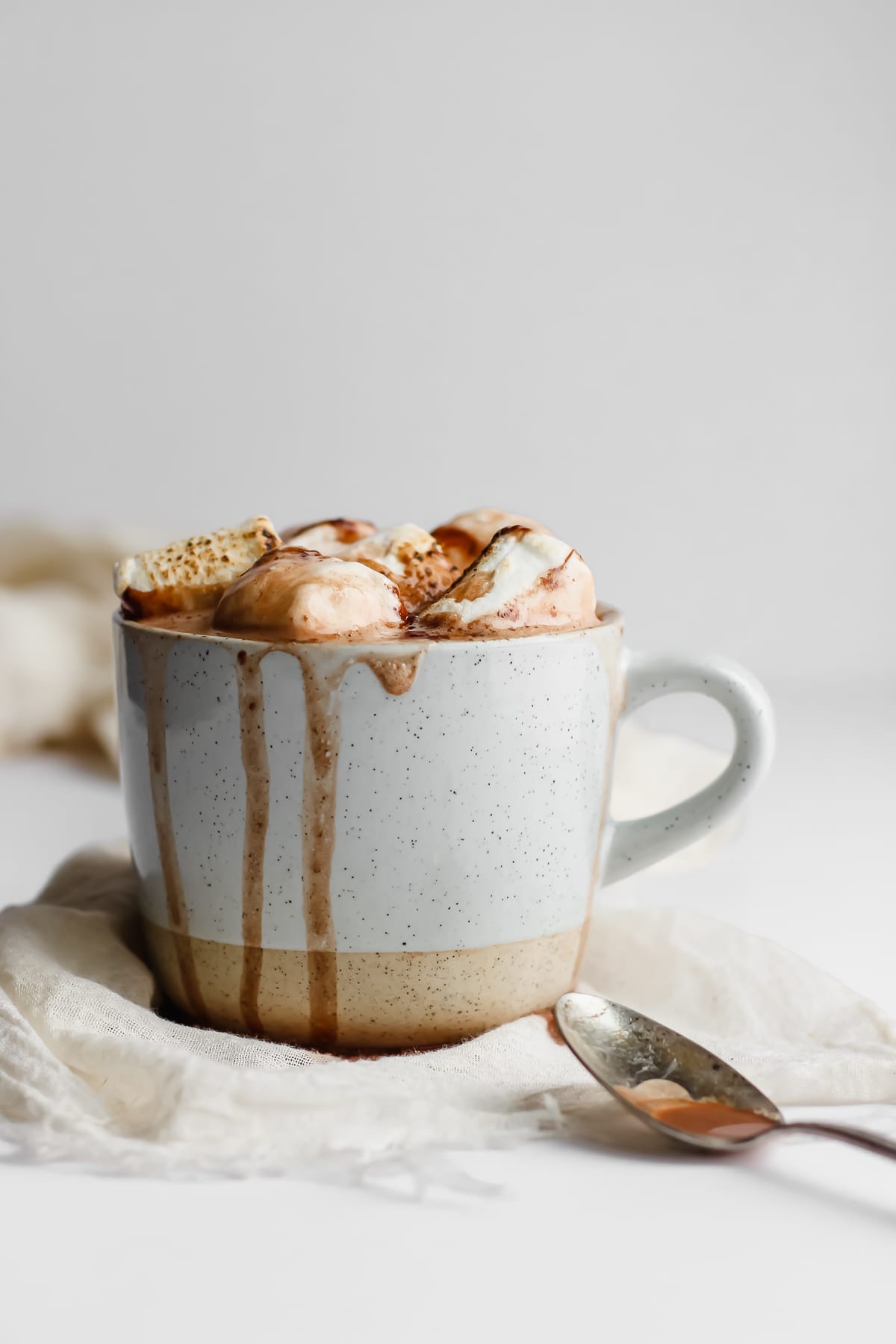 Mug of dairy-free hot chocolate with marshallows on top,