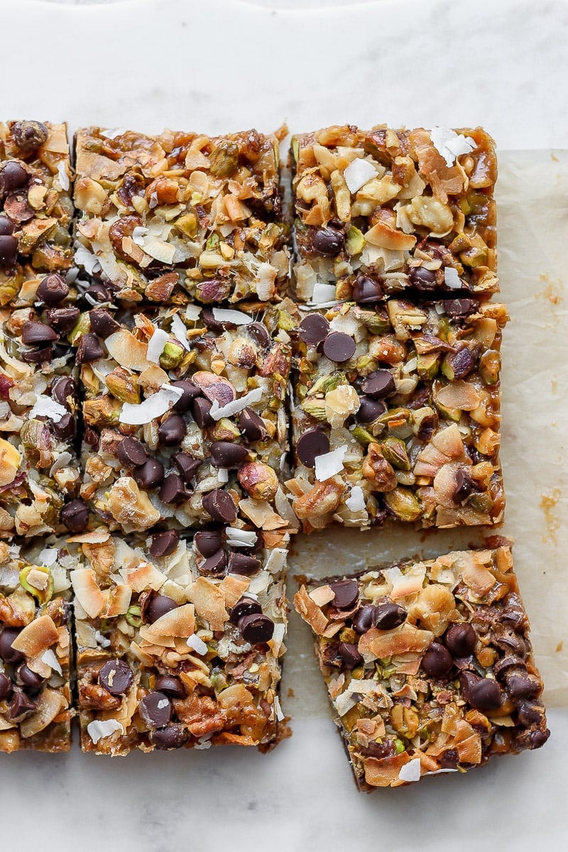 Cooked seven layer bars cut into squares. 