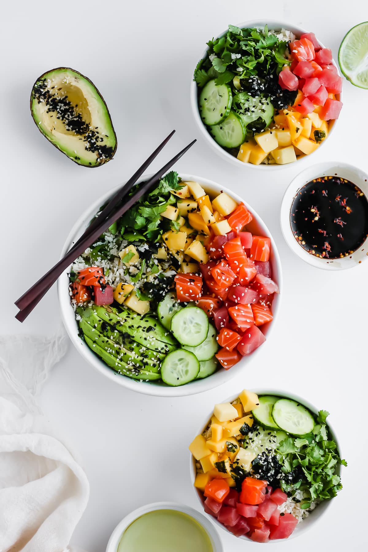 A more far away shot of 3 Whole30 Poke bowls. 