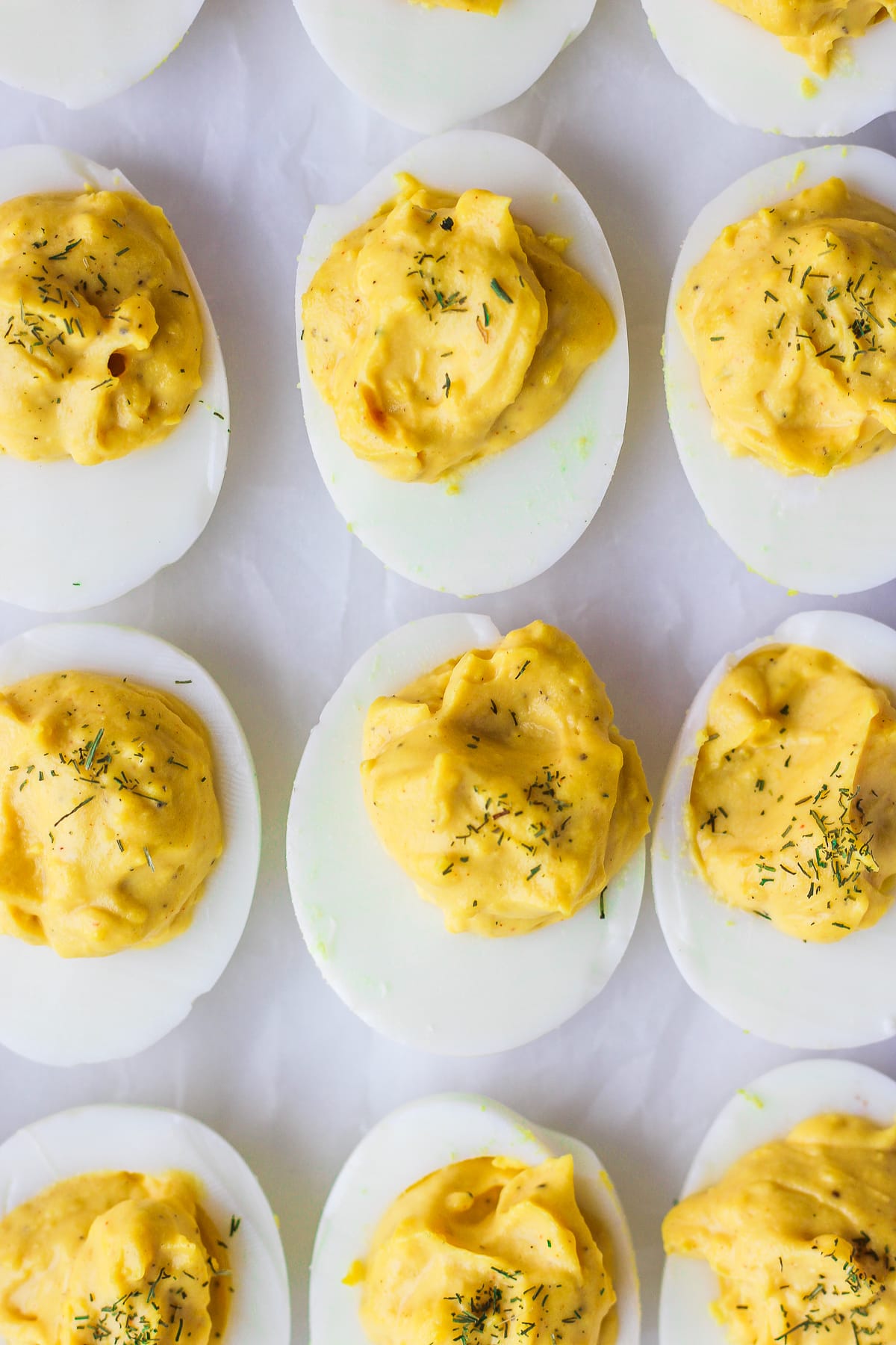 Several Whole30 deviled eggs all lined up.