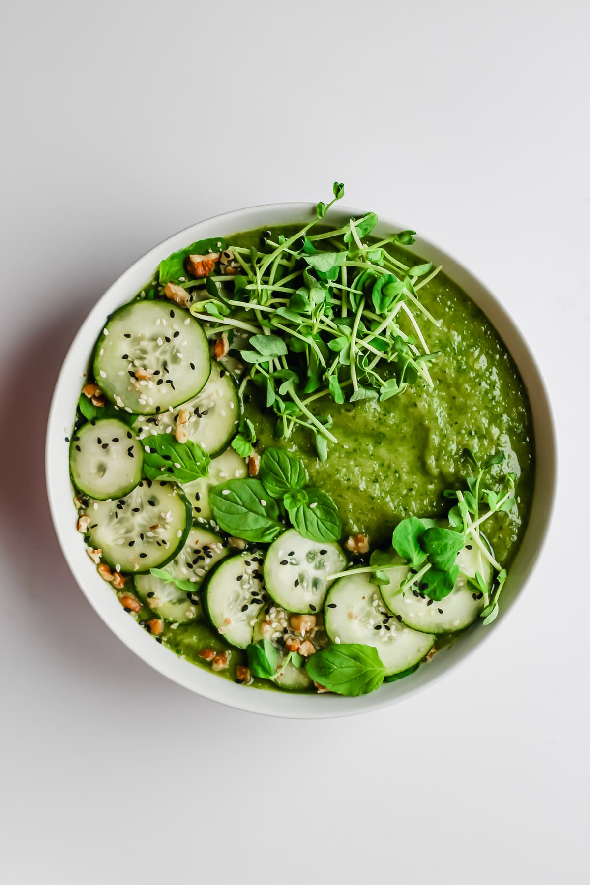 A garnished healthy green smoothie bowl.